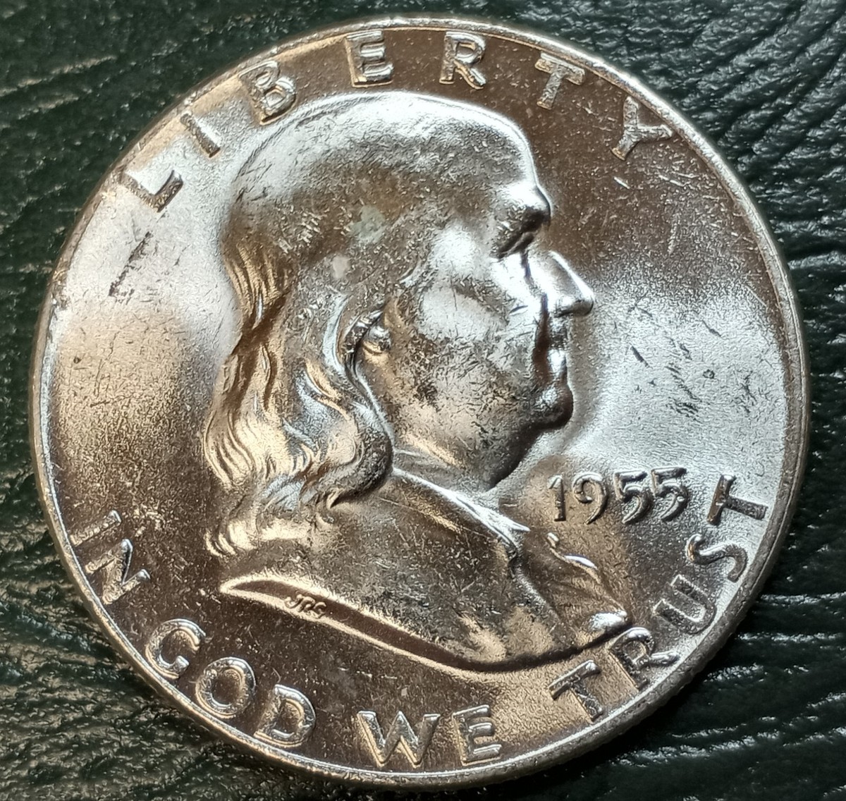 1955 Franklin Half Dollar Bugs Bunny FS-401 variety showing die clash spike at Franklin's upper lip